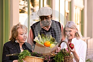 Seniors Comparing Purchases from Farmers Market photo