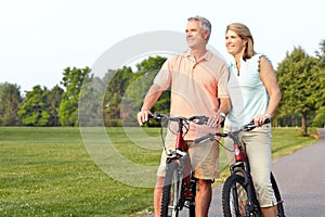 Seniors couple biking