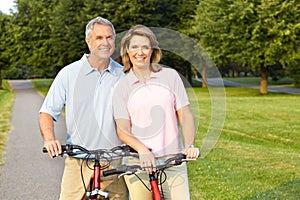 Seniors couple biking