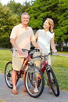 Seniors couple biking