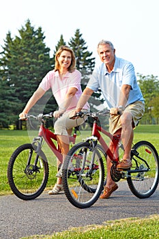 Seniors couple biking