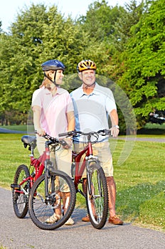 Seniors couple biking