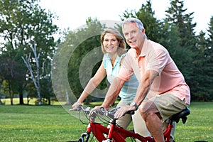 Seniors couple biking