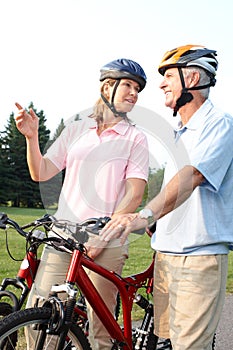 Seniors couple biking