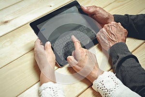 Seniors couple with tablet