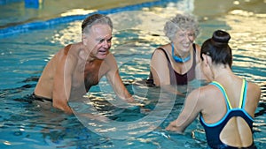 Seniors cycling on aqua bike