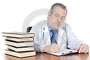 Seniors doctor writing