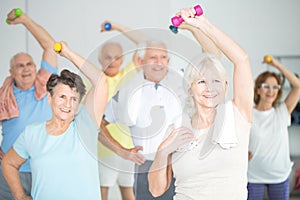 Seniors doing strength building exercises