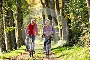 Seniors exercising with bicycle