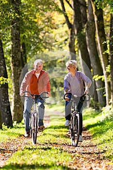 Seniors exercising with bicycle