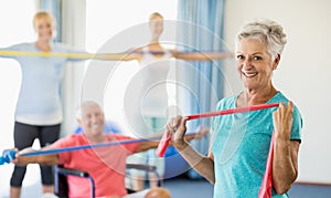 Seniors exercising with stretching bands