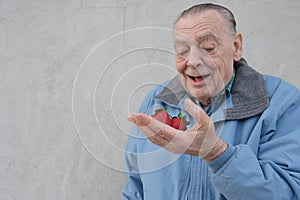 Seniors man with strawberries