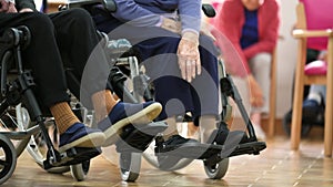 Seniors patients doing exercises in a retirement home.