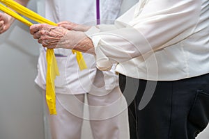 Seniors patients doing exercises in a retirement home.