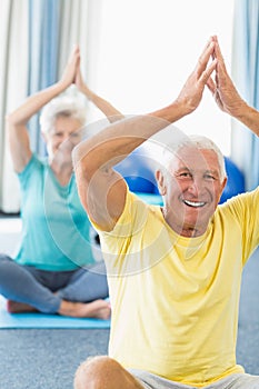 Seniors performing yoga