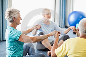 Seniors performing yoga