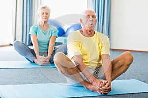 Seniors performing yoga