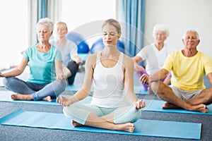 Seniors performing yoga