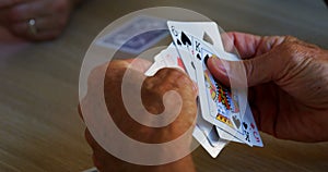 Seniors playing cards in retirement home 4k