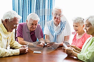 Seniors playing cards together