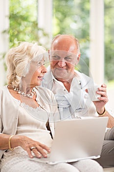 Seniors using laptop to communicate