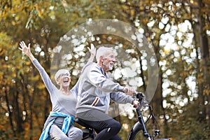 Senor copule in the park with bike