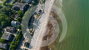 Sensational travel summertime destination high aerial view of tourist beach in Baltic sea in Scharbeutz, Germany, tilt