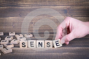 Sense. Wooden letters on the office desk