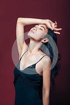 Sensetive dreaming asian woman with closed eyes relax