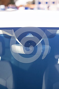 Sensors on the windshield, modern car, near the mirror