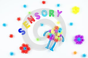 Sensory word and colorful balls that magically bunch. Sensory training, sensory integration, dysfunction and processing photo