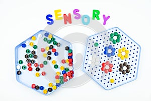 Sensory word and mosaic toy. Sensory training, sensory integration, dysfunction and processing disorder. Sensory toy