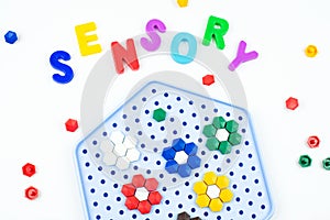 Sensory word and mosaic toy. Sensory training, sensory integration, dysfunction and processing disorder. Sensory toy