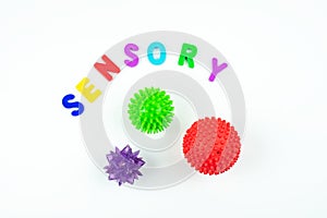 Sensory word and tactile massage ball. Sensory integration dysfunction, processing disorder.Therapy hand, development of