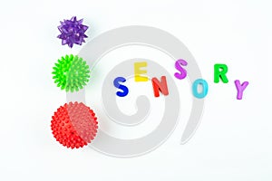 Sensory word and tactile massage ball. Sensory integration dysfunction, processing disorder.Therapy hand, development of