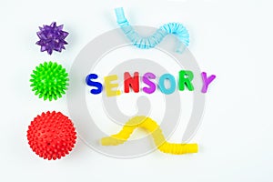 Sensory word and tactile massage ball. Sensory integration dysfunction, processing disorder.Therapy hand, development of