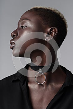 Sensual african american woman wearing leather choker