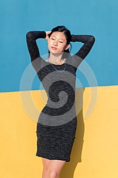 Sensual asian woman posing in a tight dress