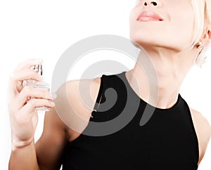 Sensual blonde applying perfume