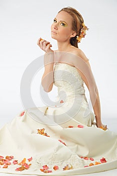 Sensual bride with rose petals