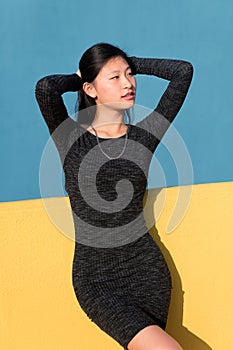 Sensual chinese woman posing in a tight dress