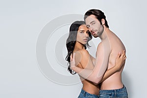 sensual couple in jeans only embracing