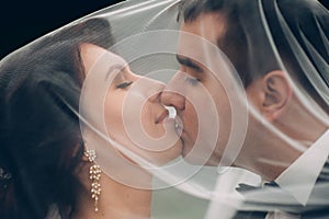 Sensual couple portrait, romantic newlywed bride and groom huggi