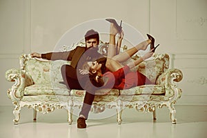 Sensual couple on sofa. sensual woman and bearded man relax. sensual girl with her man. sensual and beautiful.