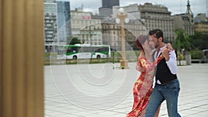 A sensual couple of tango dancers dancing professionally in Puerto Madero