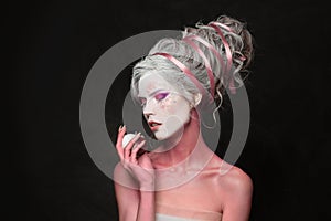 Sensual creative fashionable carnival model woman blonde, fashion beauty studio portrait