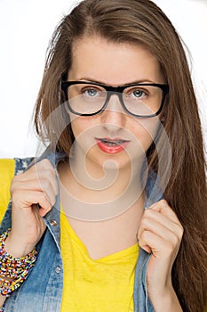 Sensual girl wearing geek glasses isolated