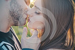 Sensual Kiss. Close-up of beautiful passionate couple kissing. Sexy couple In Love. Intimate relations. Mouths kissing