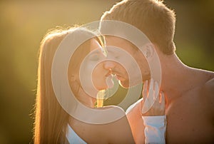 Sensual kiss. Man kissed tender woman. Portrait of lovely couple in love. Young sensual girlfriend glad to passionate