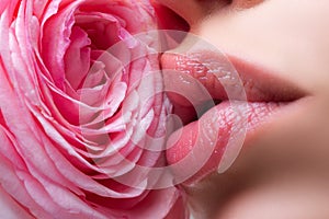 Sensual Lips closeup. Beautiful woman lips with rose.